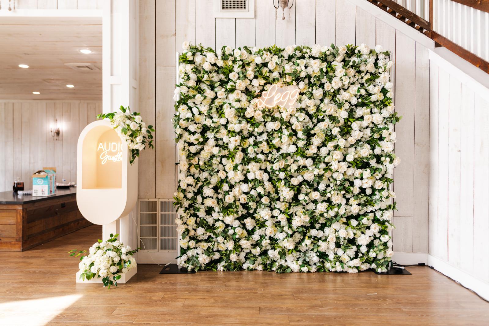 Wedding flower wall in rustic barn