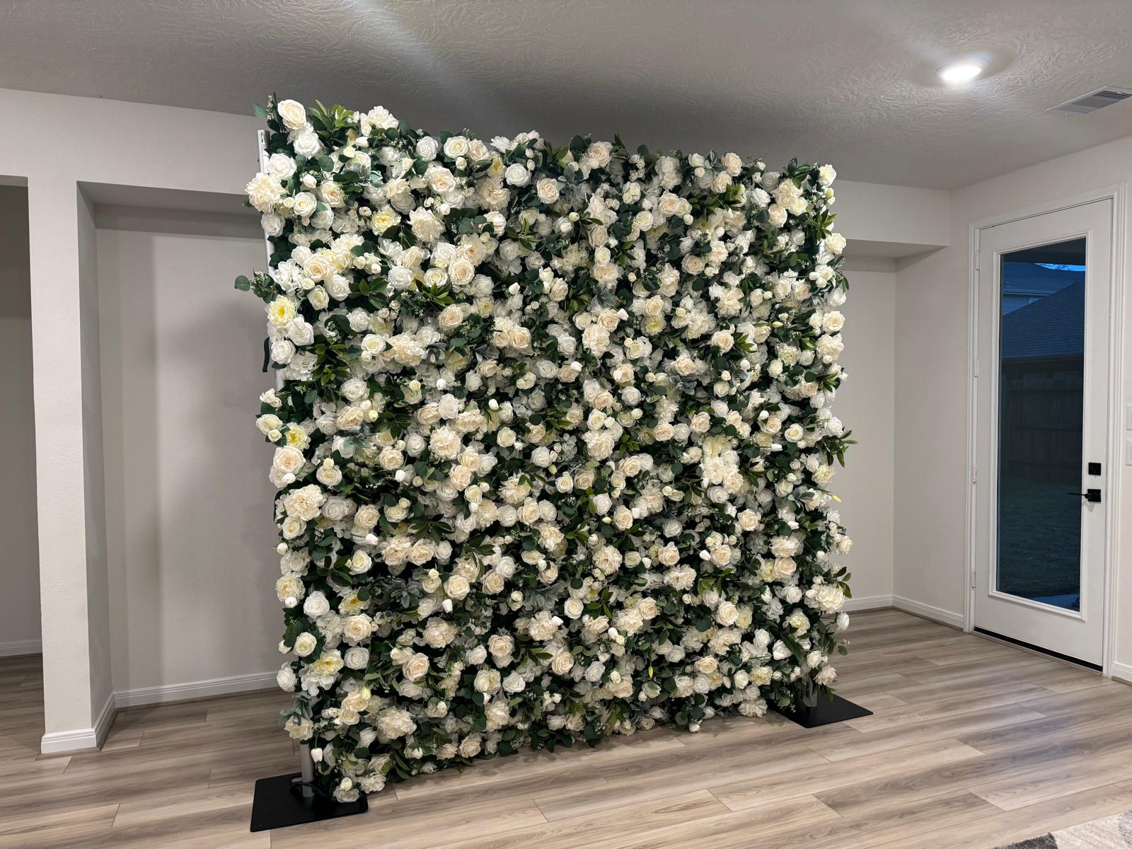 Flower wall setup at a venue entrance