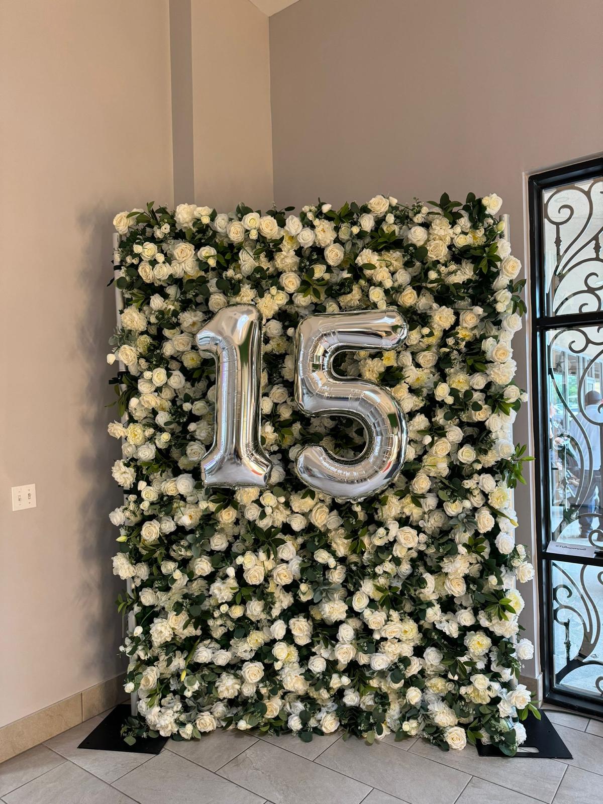 Flower wall setup at a reception