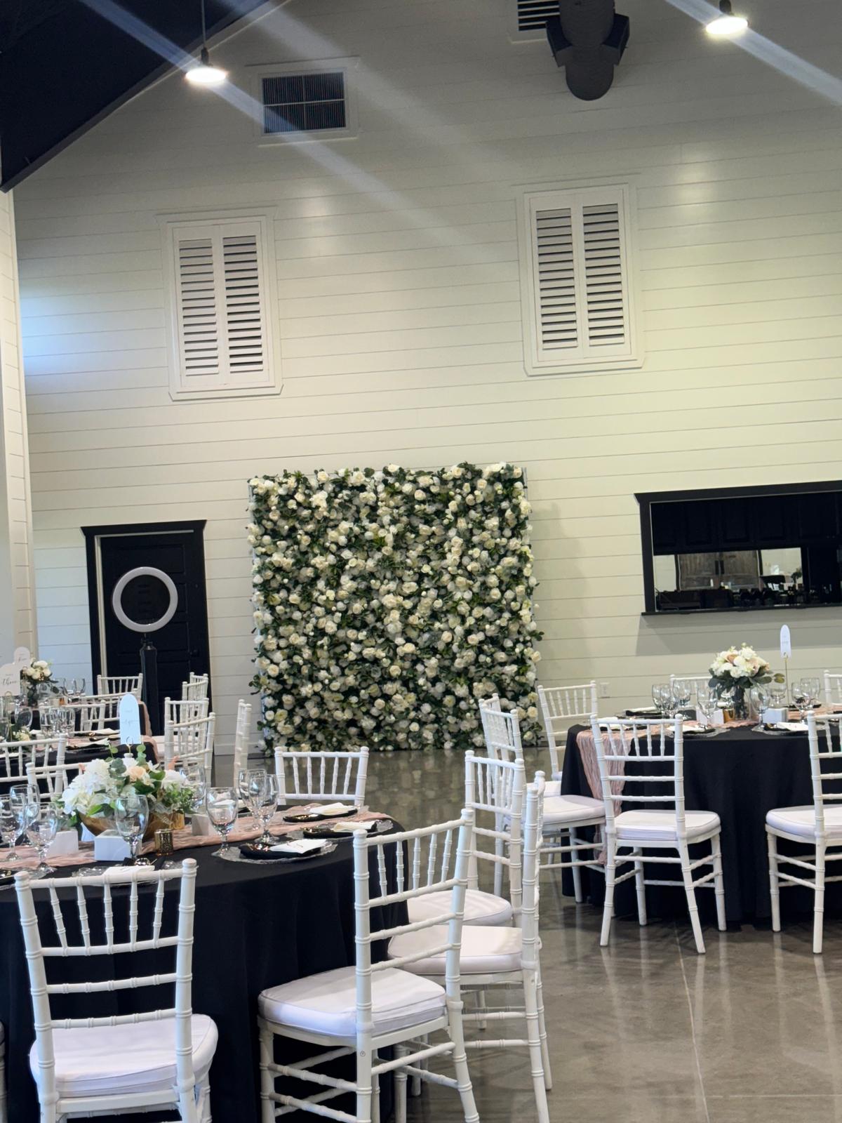 Flower wall installation at an event