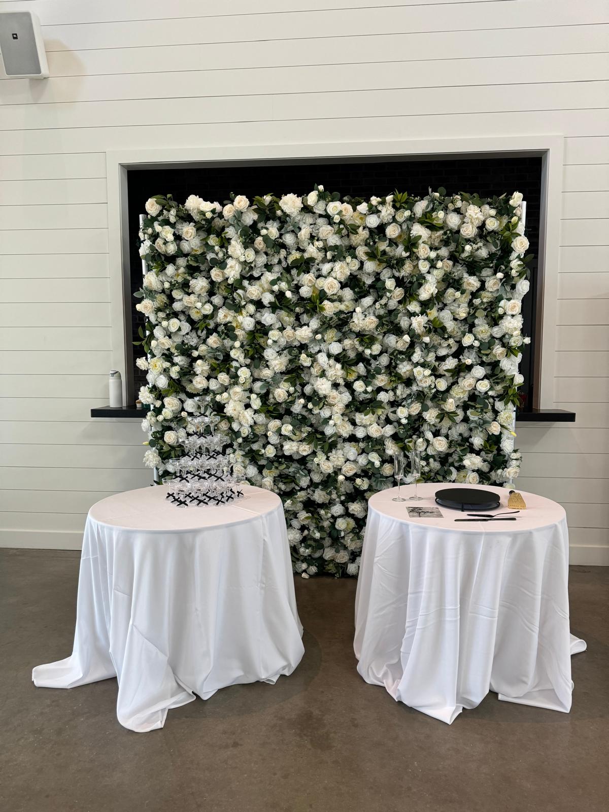 Flower wall rental with signage